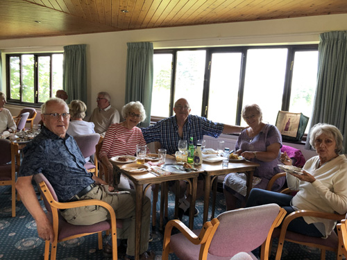 David, Barbara, Alan, Wendy & Sheila sitting at a table in the Clubhouse