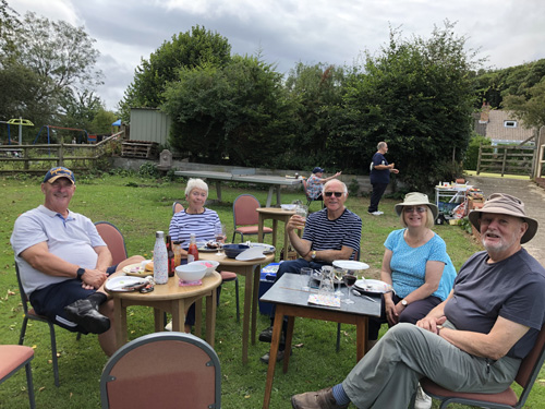 Bob C, Sandra, Alan, Margie & Ken sitting outside