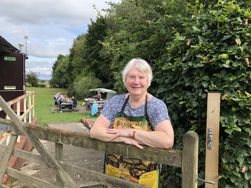 Maggie leaning on the gate