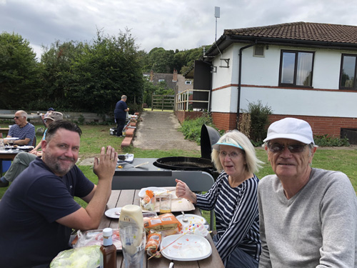 Mark, Rod & Kath at an outdoor picnic table