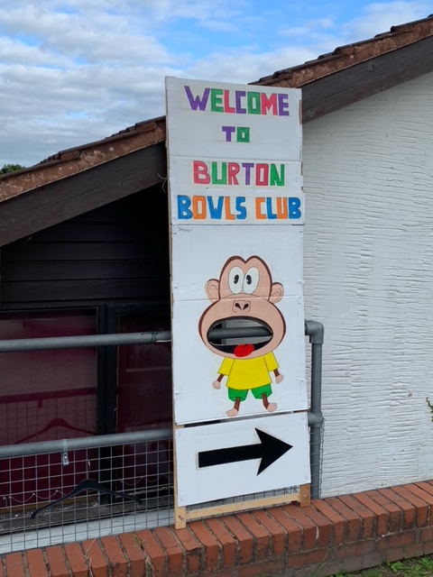 Welcome sign with cartoon monkey