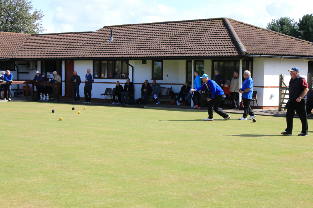 Looking towards the Clubhouse. A match in progress with spectators.