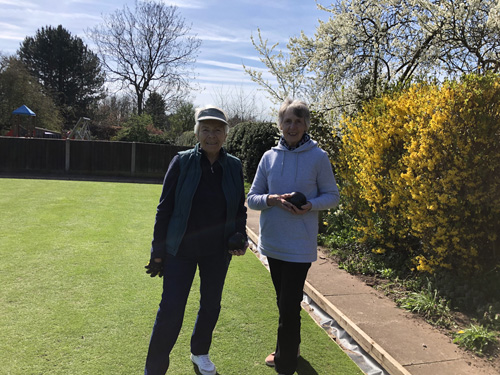 Sandra and Chris pose on the green