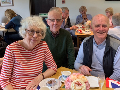 Sitting with food and drink. Barbara, David & Mike