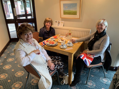 Sitting with food and drink. Helen, Jill & Jean.