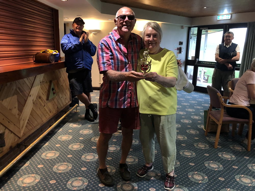 In the Clubhouse, Maggie & Alan pose with the trophy.