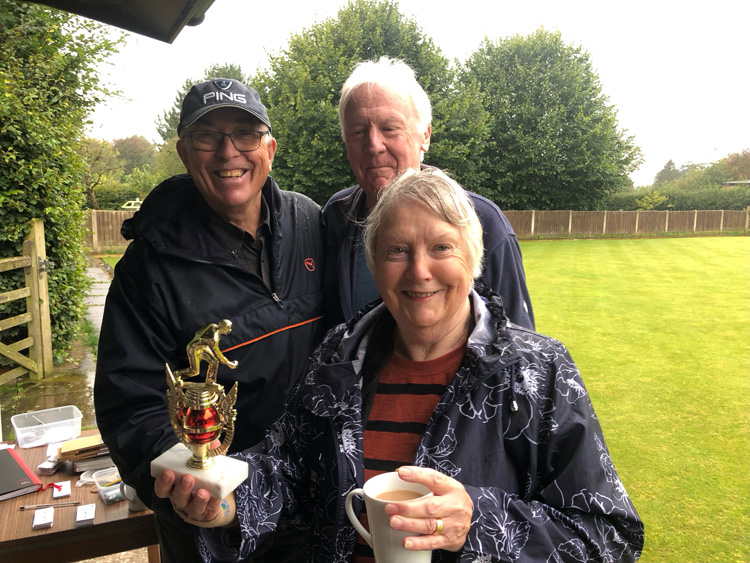 Maggie & Alan pose with th trophy. Brian in the background