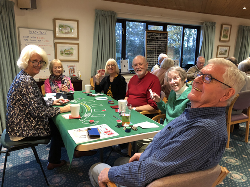 Lindy, Sonja, Margie, Ken, Norma and Dave at the Blackjack table. All smiling into the camera