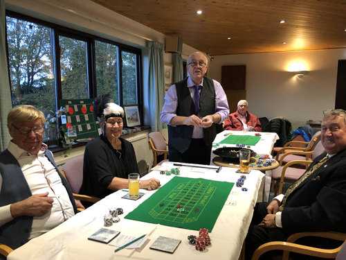 Howard, Pat, Alan (Croupier), and Kevin at the Roulette table. Mike in the background