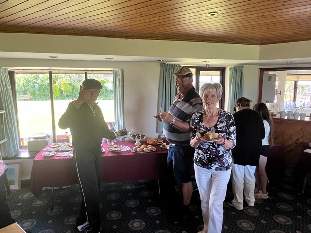 B&P members by the buffet table.