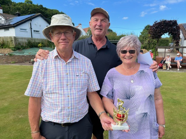 Ian and Wendy pose with the trophy. With Bob behind them