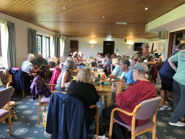 A view from the patio doors showing attendees