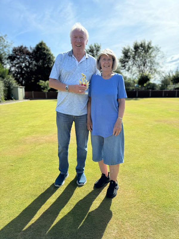 Brian and Kath pose with the trophy