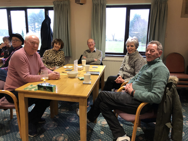 Brian, Jackie, Margaret and Roy seated at a table