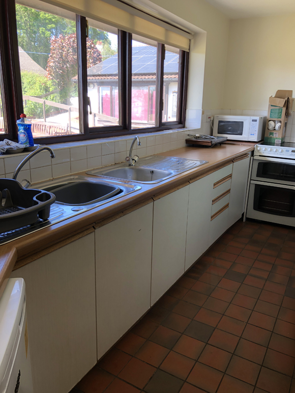 Picture of Clubhouse kitchen from the doorway showing clean and clear countertops and windowsill